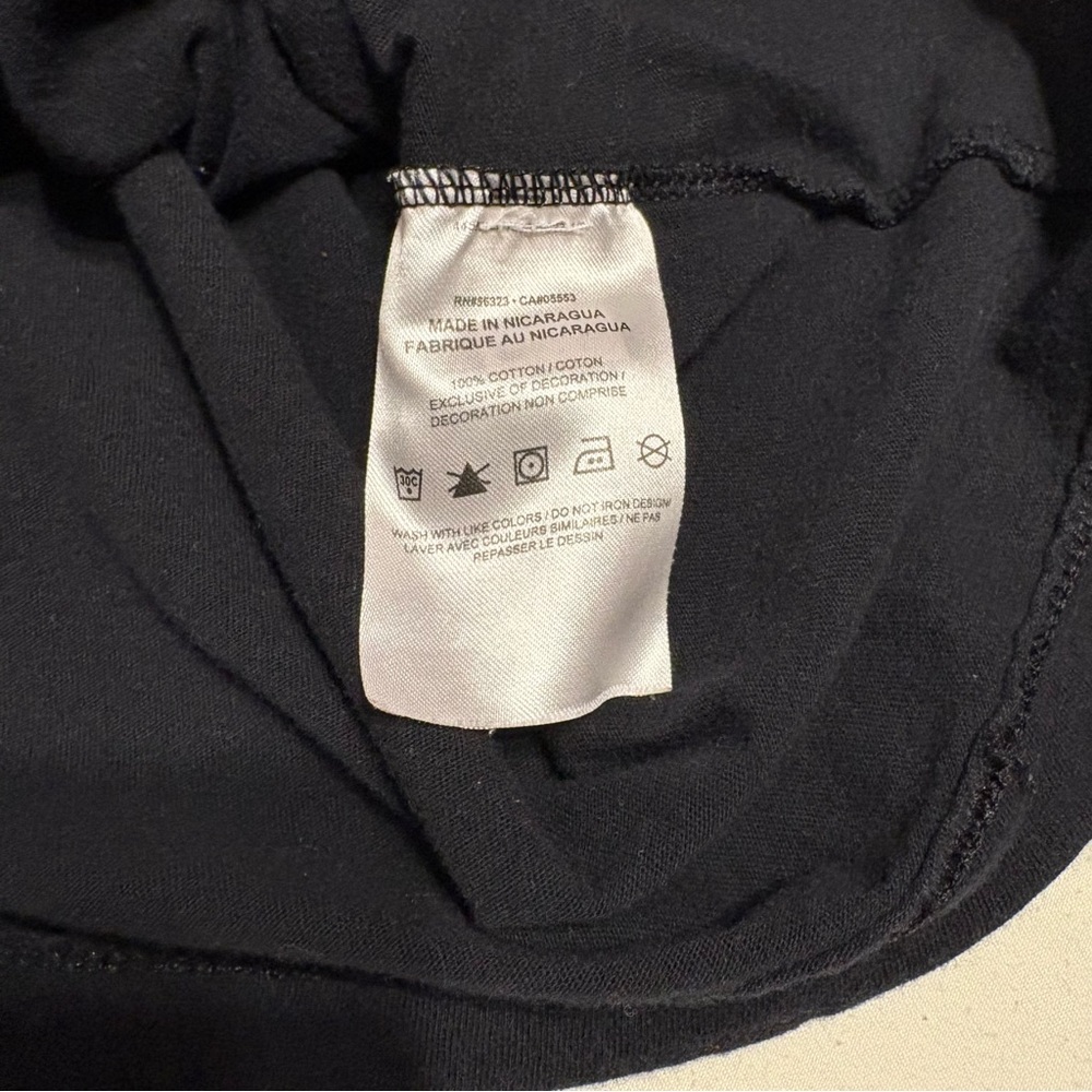 Black Nike T-shirt featuring an orange butterfly graphic logo - Picture 5 of 6